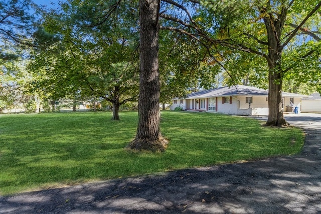 exterior space featuring a front lawn