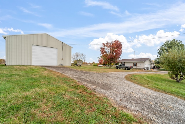 garage featuring a lawn