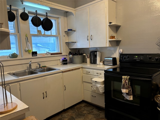 kitchen featuring white cabinetry, black range with electric cooktop, and sink