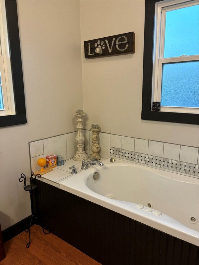 bathroom featuring a bathtub and hardwood / wood-style floors