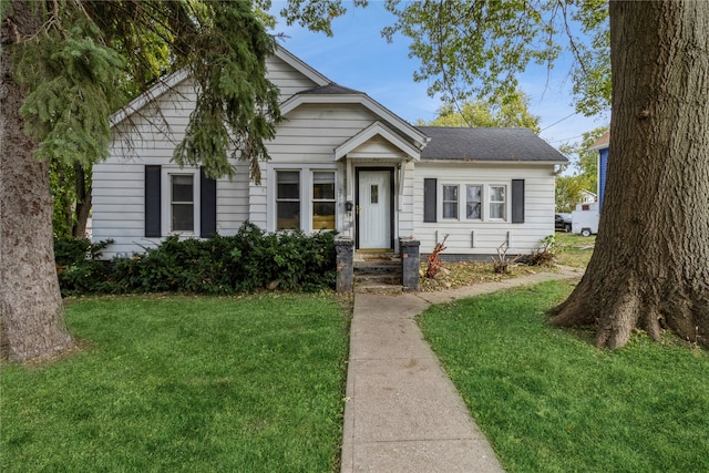 bungalow with a front yard