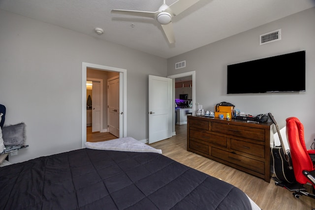 bedroom with ceiling fan and light wood-type flooring