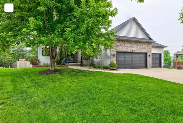 obstructed view of property with a garage and a front lawn