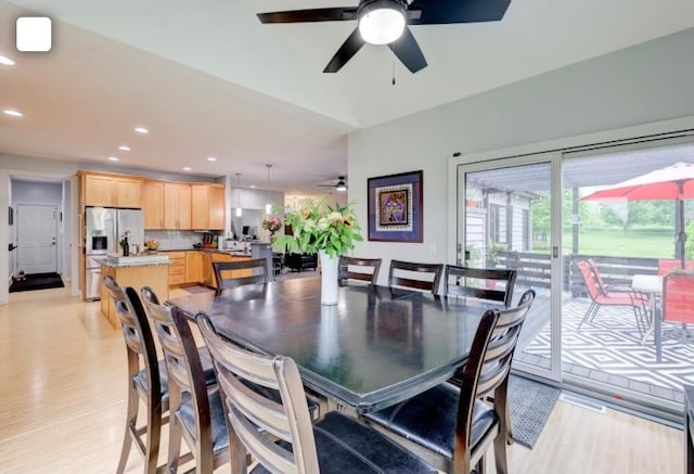 dining area featuring light wood-type flooring and ceiling fan