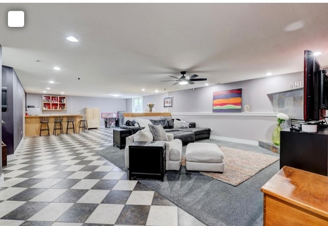 living room with indoor bar and ceiling fan