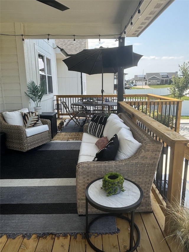 wooden deck with a water view