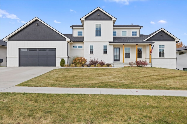 view of front of home featuring a front lawn and a garage