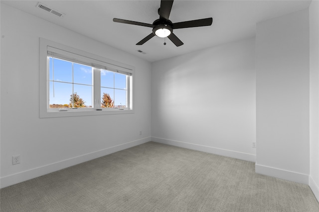 empty room with light carpet and ceiling fan