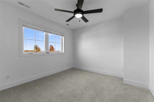 675 Daybreak Dr, Waukee, IA 50263 - spare room with baseboards, a ceiling fan, and light carpet