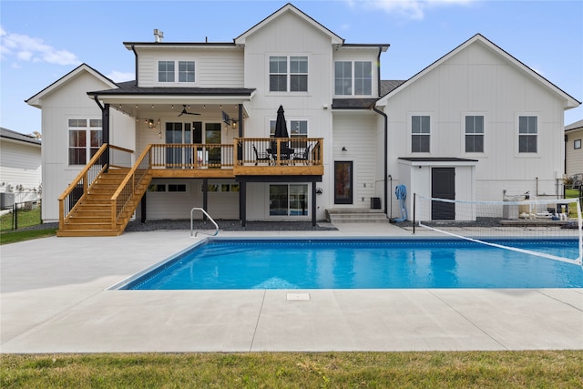 rear view of property featuring a patio area and ceiling fan