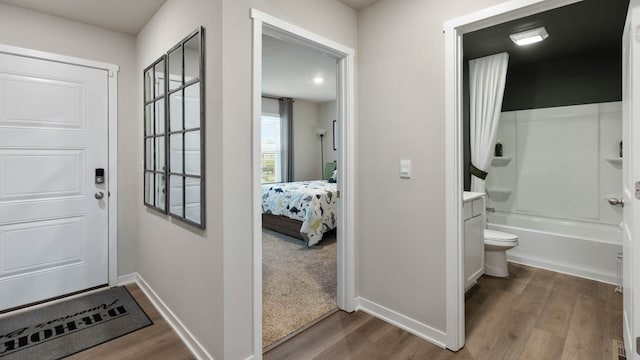 doorway to outside featuring hardwood / wood-style flooring