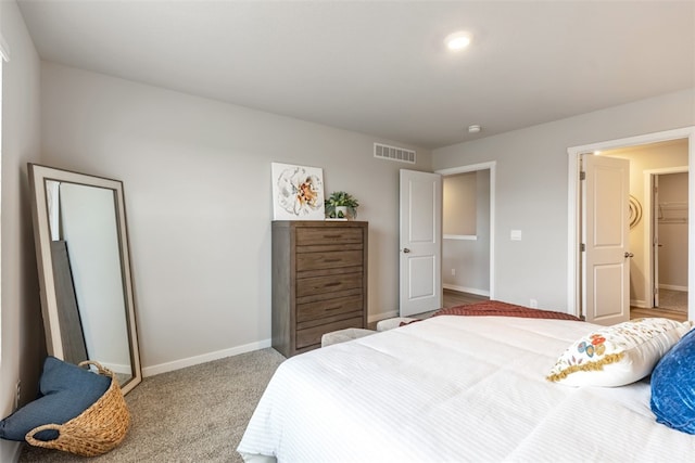 bedroom featuring light carpet