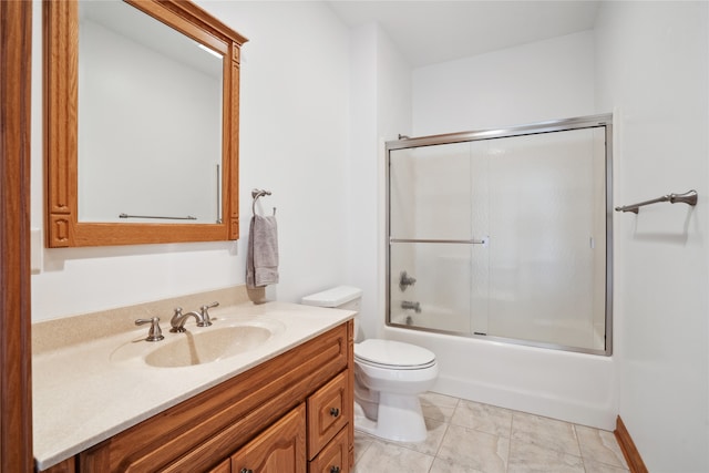 full bathroom with vanity, toilet, tile patterned flooring, and bath / shower combo with glass door