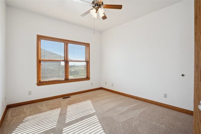 carpeted empty room with ceiling fan