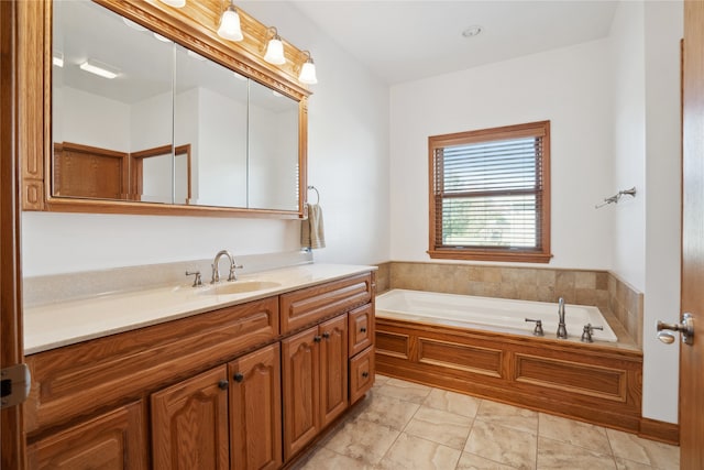 bathroom with a bathing tub and vanity