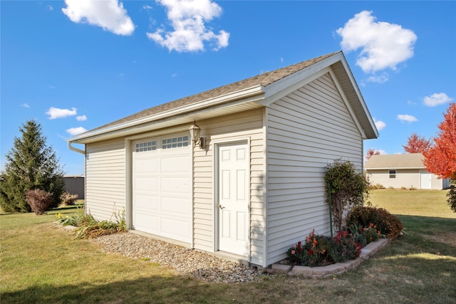 garage with a lawn