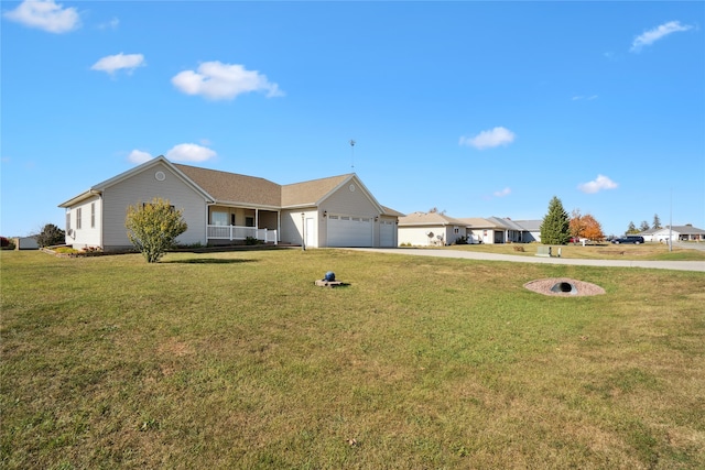 single story home featuring a front lawn and a garage