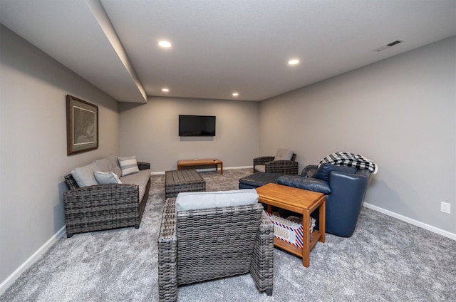 living area featuring carpet floors, recessed lighting, visible vents, and baseboards