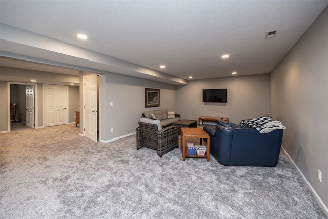 living area featuring carpet floors, recessed lighting, visible vents, and baseboards