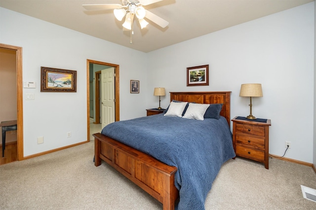 bedroom with baseboards, visible vents, ceiling fan, and light colored carpet