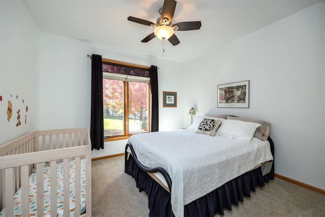 bedroom with a ceiling fan, carpet, and baseboards