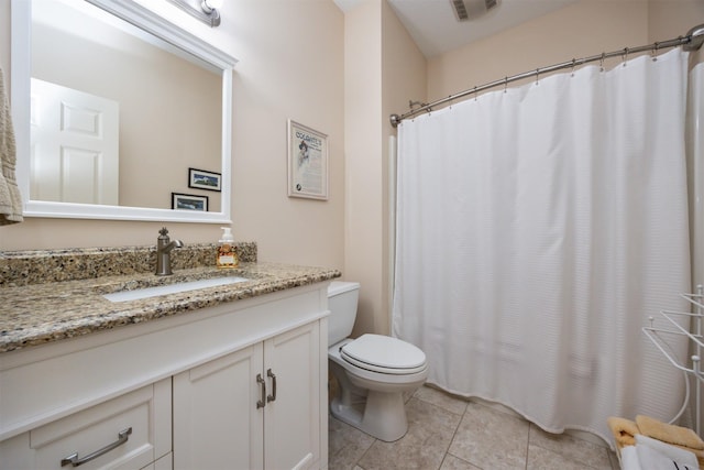 bathroom with visible vents, toilet, a shower with curtain, tile patterned flooring, and vanity