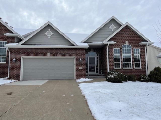 single story home with a garage, brick siding, and driveway