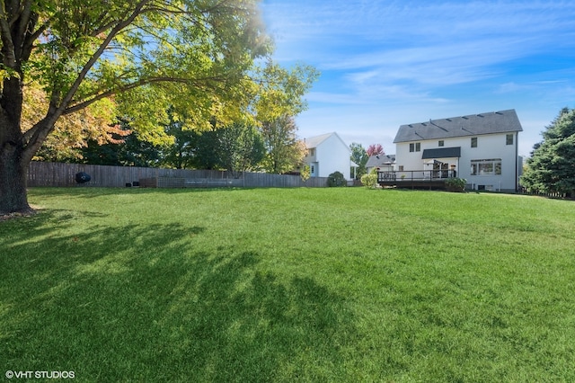 view of yard with a wooden deck