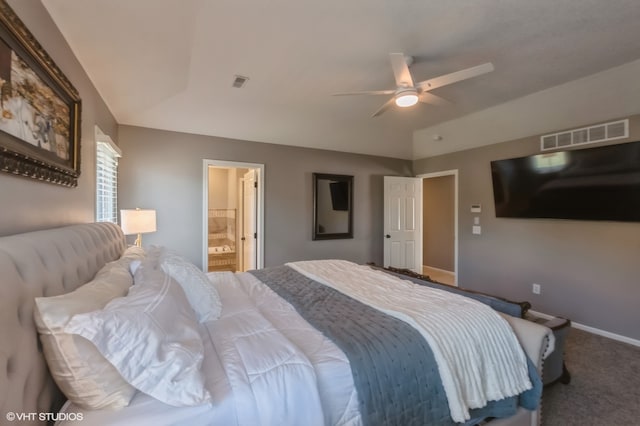 carpeted bedroom featuring ceiling fan and ensuite bath