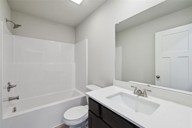 bathroom featuring toilet, tub / shower combination, and vanity