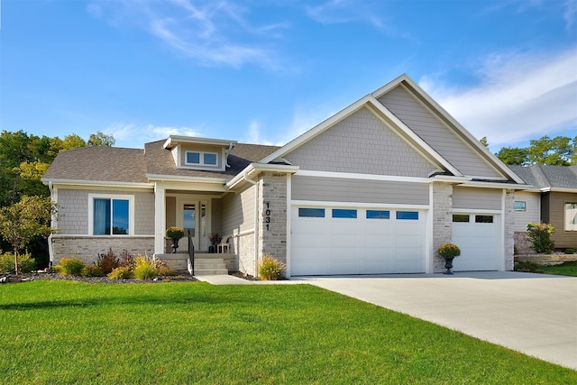 craftsman inspired home with a front yard and a garage