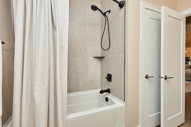 bathroom featuring shower / bath combo with shower curtain and hardwood / wood-style floors