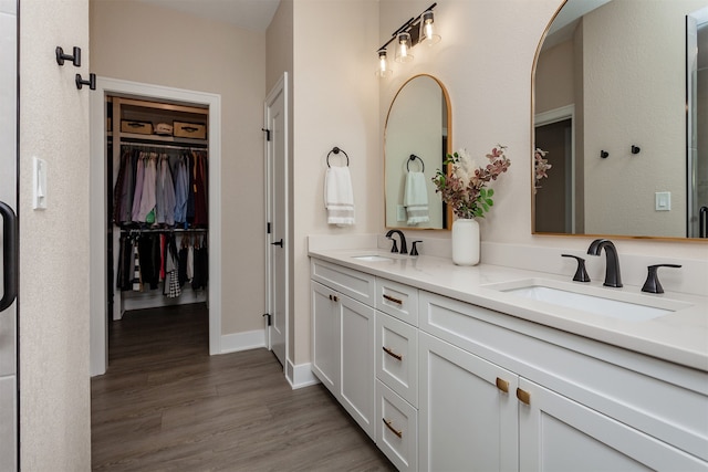 bathroom featuring vanity and hardwood / wood-style floors