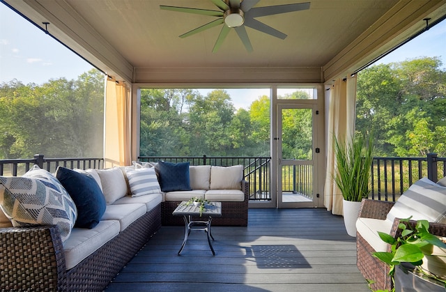 sunroom featuring ceiling fan