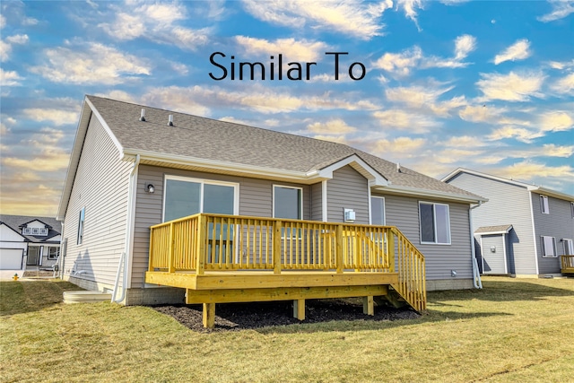 back of house with a deck and a lawn