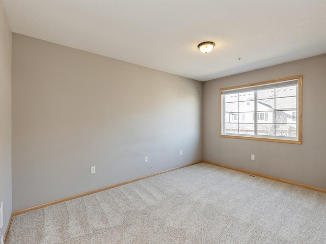 unfurnished room featuring carpet floors