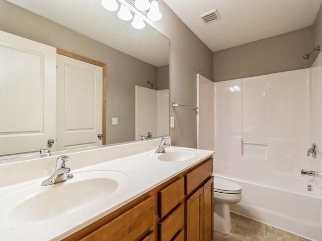 full bathroom featuring vanity,  shower combination, and toilet