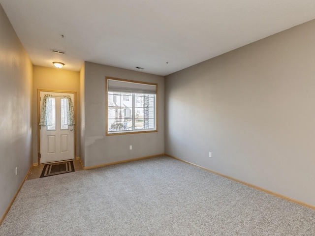 spare room featuring carpet flooring