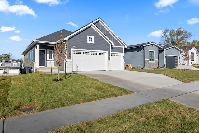 view of front of property with a garage and a front yard