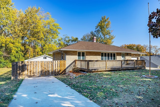 exterior space with a wooden deck and a yard