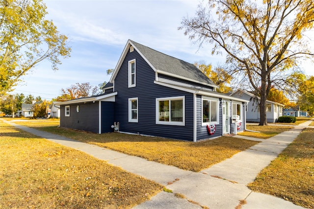 view of property exterior with a yard