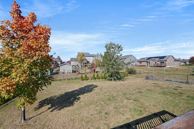 view of yard with fence and a residential view