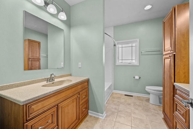 bathroom with tile patterned flooring, shower / tub combination, toilet, baseboards, and vanity