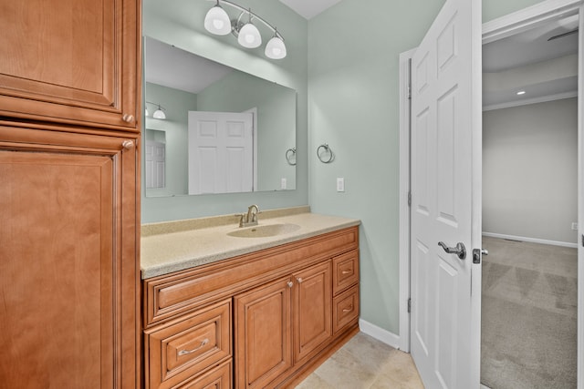 bathroom with baseboards and vanity