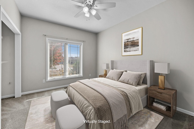 carpeted bedroom featuring baseboards and a ceiling fan