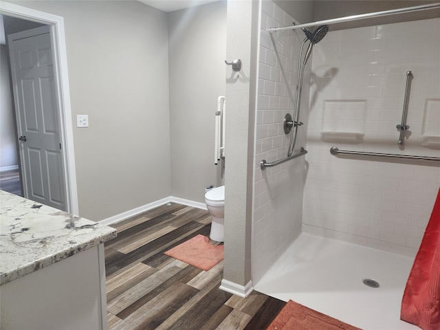 700HICKORYST Hickory St, Creston, IA 50801 - bathroom featuring toilet, baseboards, a shower stall, and wood finished floors