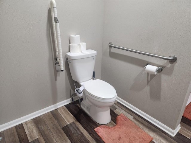 700HICKORYST Hickory St, Creston, IA 50801 - bathroom featuring baseboards, toilet, and wood finished floors
