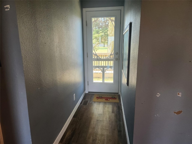 700HICKORYST Hickory St, Creston, IA 50801 - doorway to outside featuring baseboards, a textured wall, wood finished floors, and visible vents