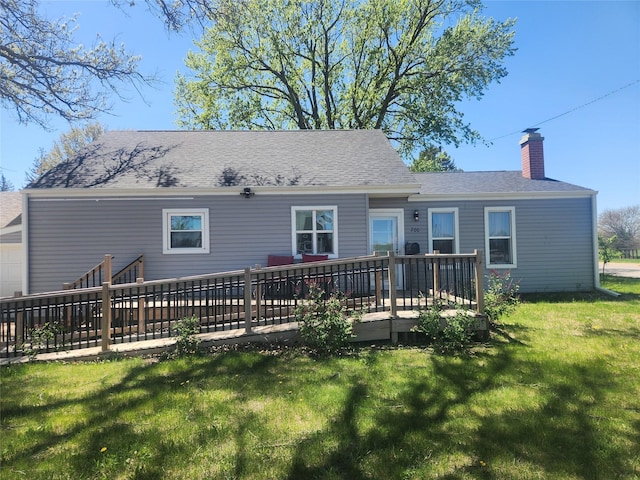 700HICKORYST Hickory St, Creston, IA 50801 - back of house featuring roof with shingles, a chimney, a yard, and a deck