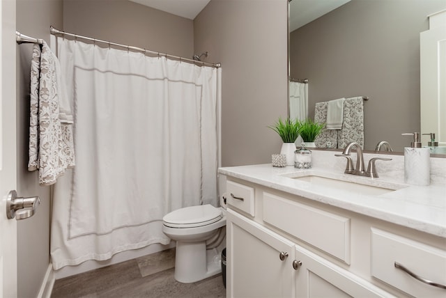 bathroom with vanity, toilet, wood-type flooring, and a shower with shower curtain